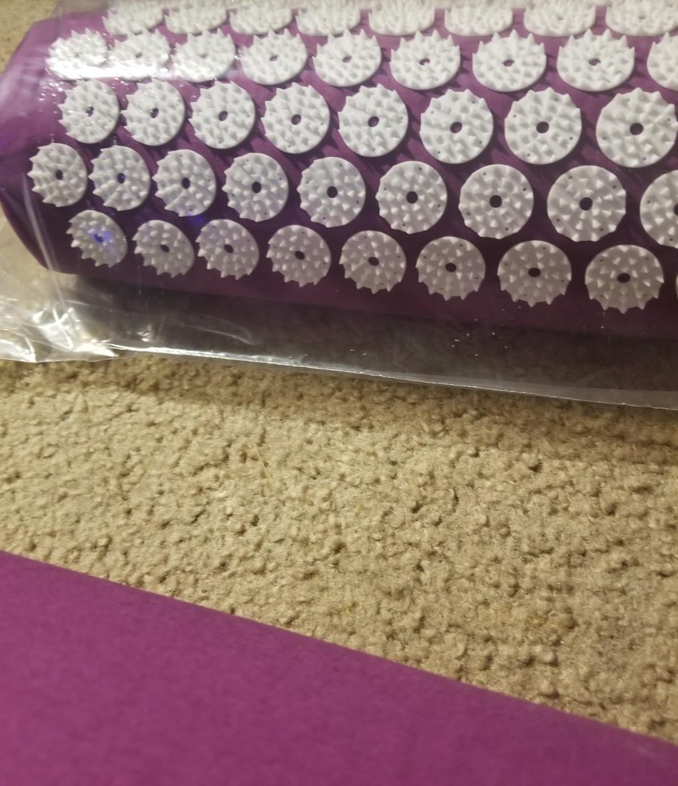 Customer photo of the purple acupressure pillow in its packaging
